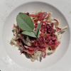 Foto Tagliatelle di grano saraceno con fonduta di zola e radicchio croccante